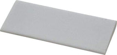 Norton - 4" Long x 1-3/4" Diam x 3/8" Thick, Novaculite Sharpening Stone - Round, Ultra Fine Grade - A1 Tooling