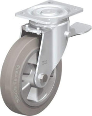 Blickle - 8" Diam x 2" Wide x 9-41/64" OAH Top Plate Mount Swivel Caster with Brake - Solid Rubber, 1,210 Lb Capacity, Ball Bearing, 5-1/2 x 4-3/8" Plate - A1 Tooling